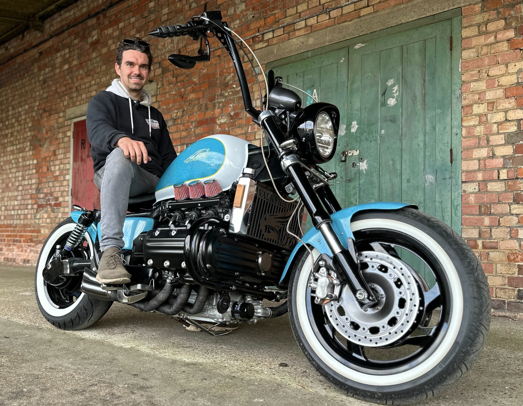 Adam Raggett with his blue and white custom Honda Valkyrie bobber